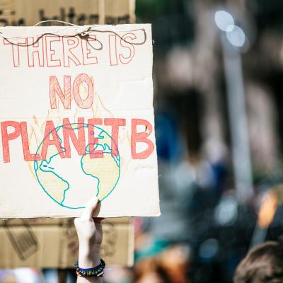 Protesters holding sign that says There is no planet B