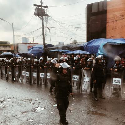 Mexican police on a rainy day, ready to contain street vendors from one of the most conflictive areas of Mexico City, the Tacubaya neighborhood